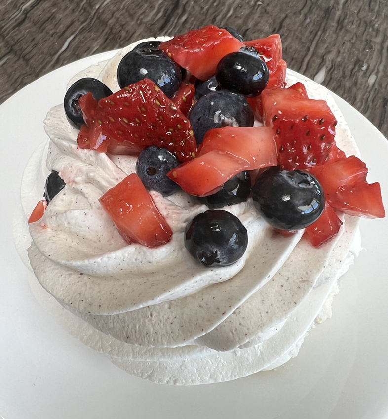 Pavlova dessert with fruit topping
